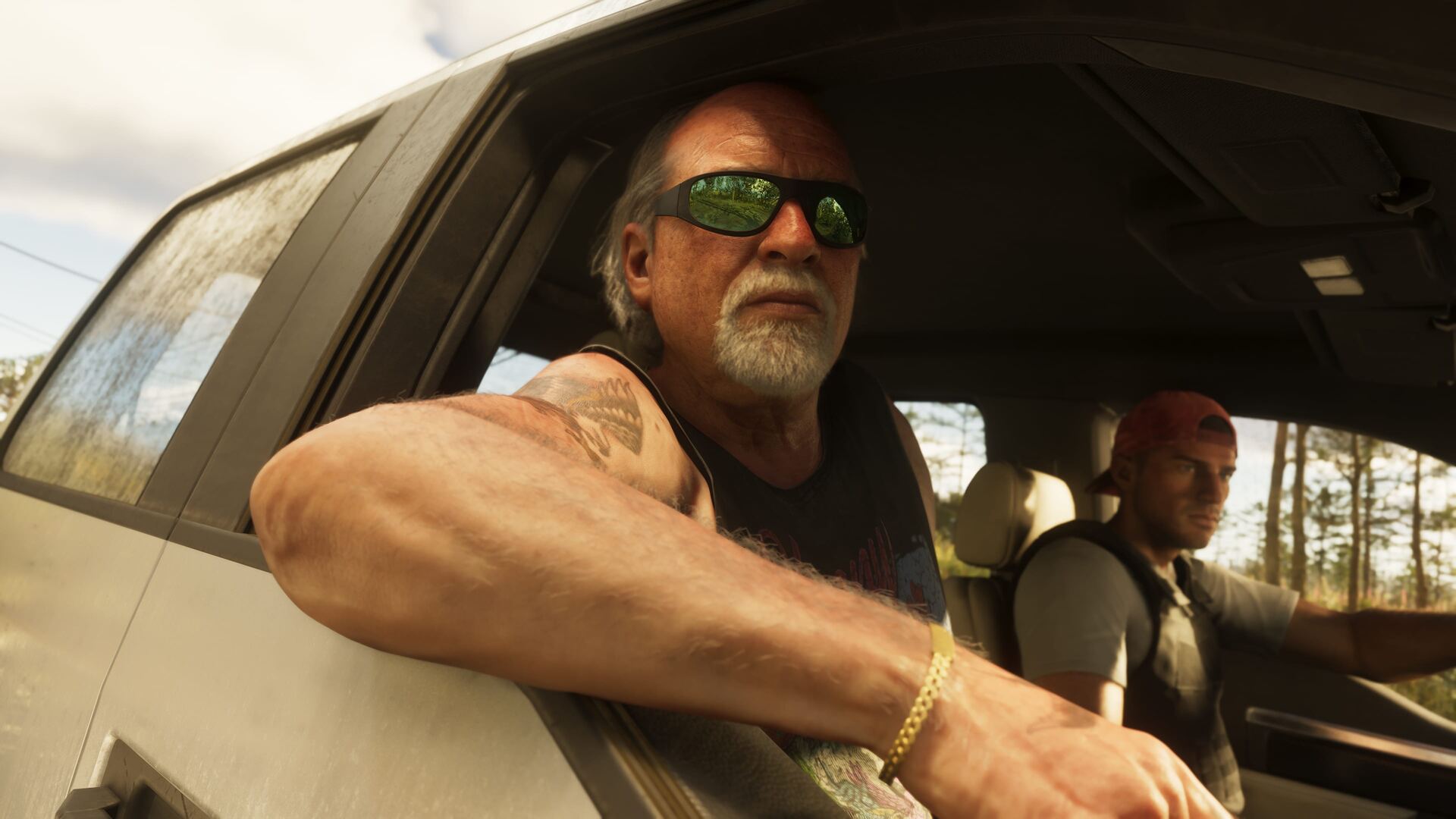 Brian Heder, personnage de GTA 6, penché à la fenêtre d'un pick-up sur une route de Leonida