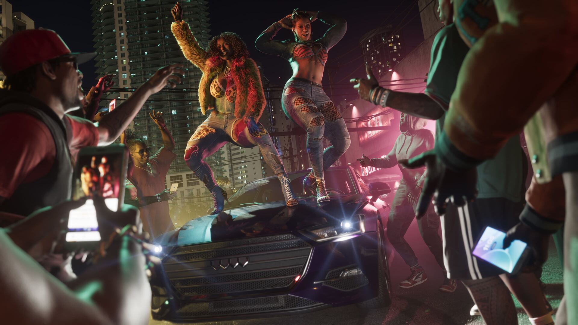 Real Dimez, duo de personnages de GTA 6, dansant sur le capot d'une voiture entourées d'une foule